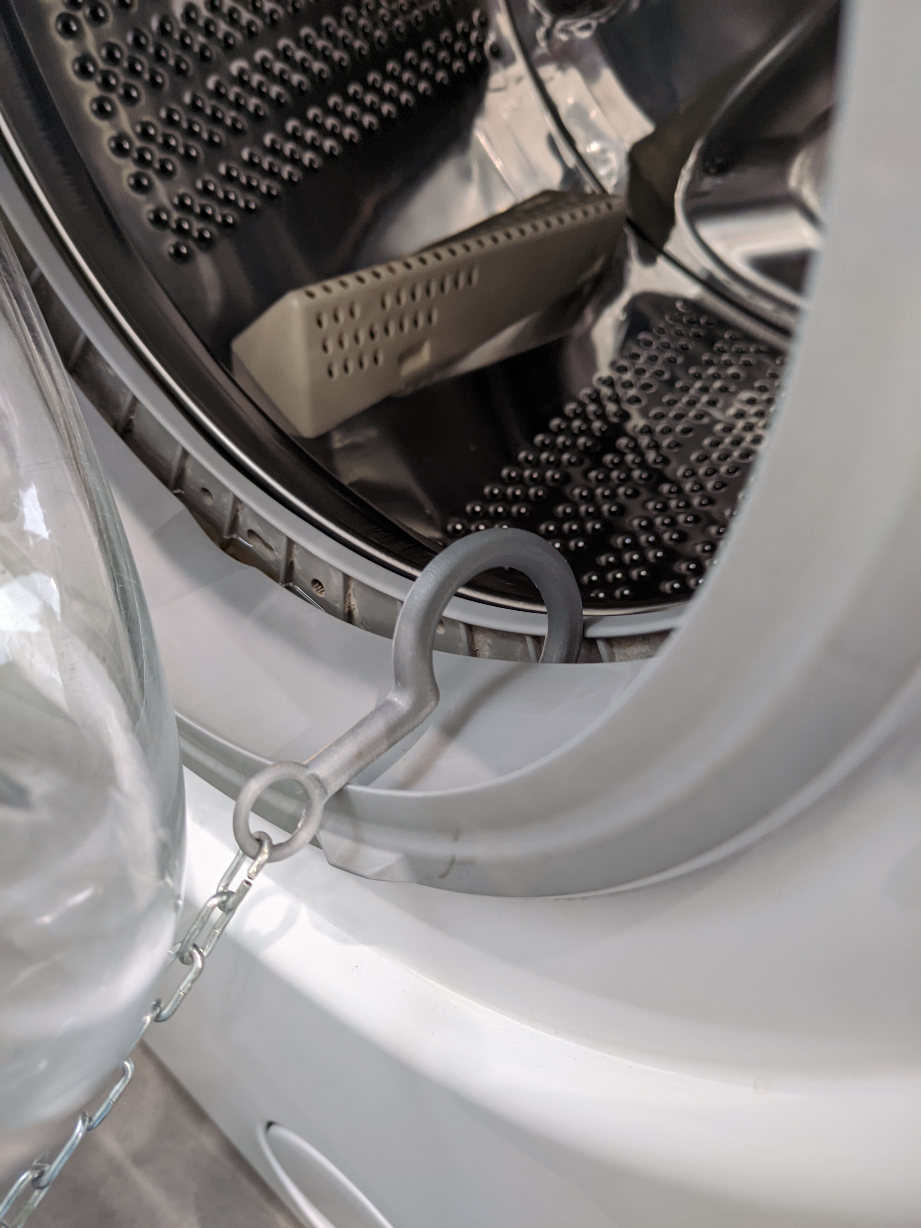 Washing machine door hook