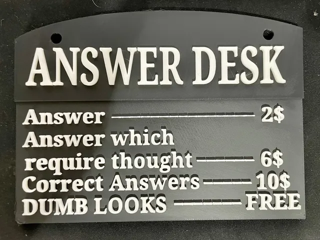 Answer Desk sign in black and white