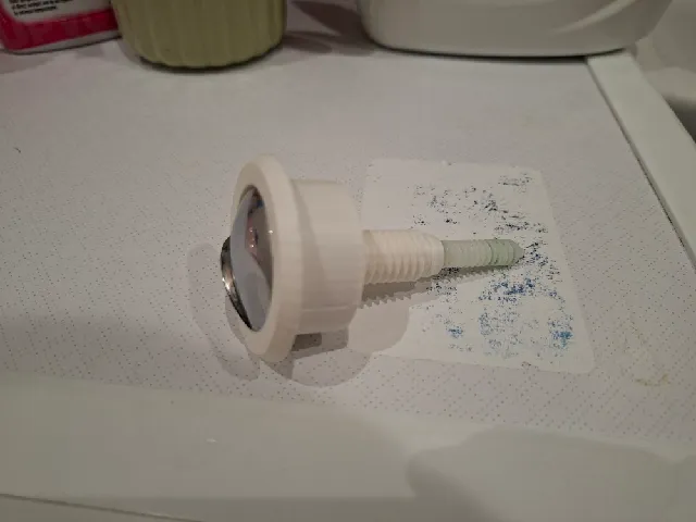 Toilet flush button fixture