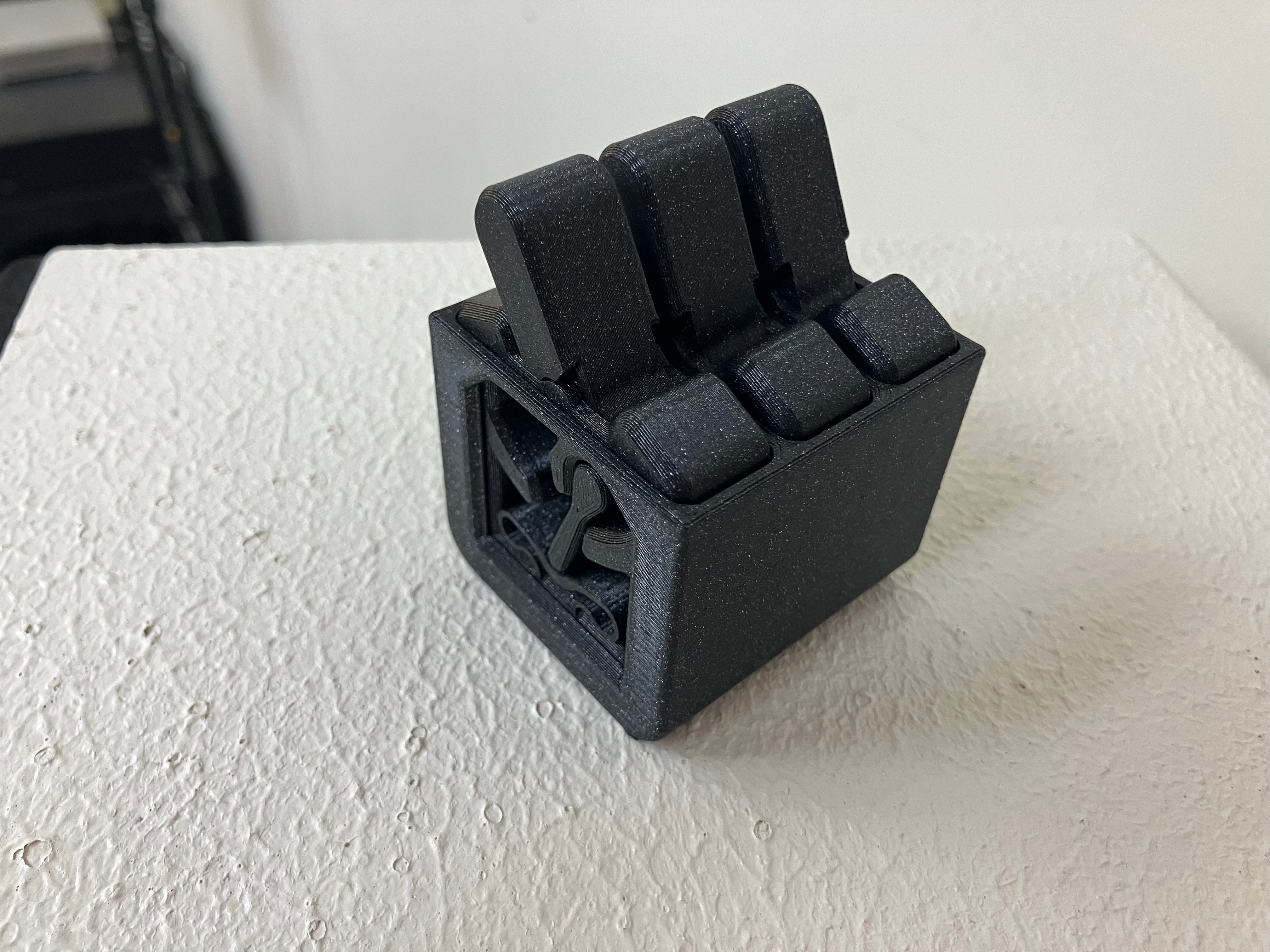 Surround for three wobble toggle clicky fidget switches