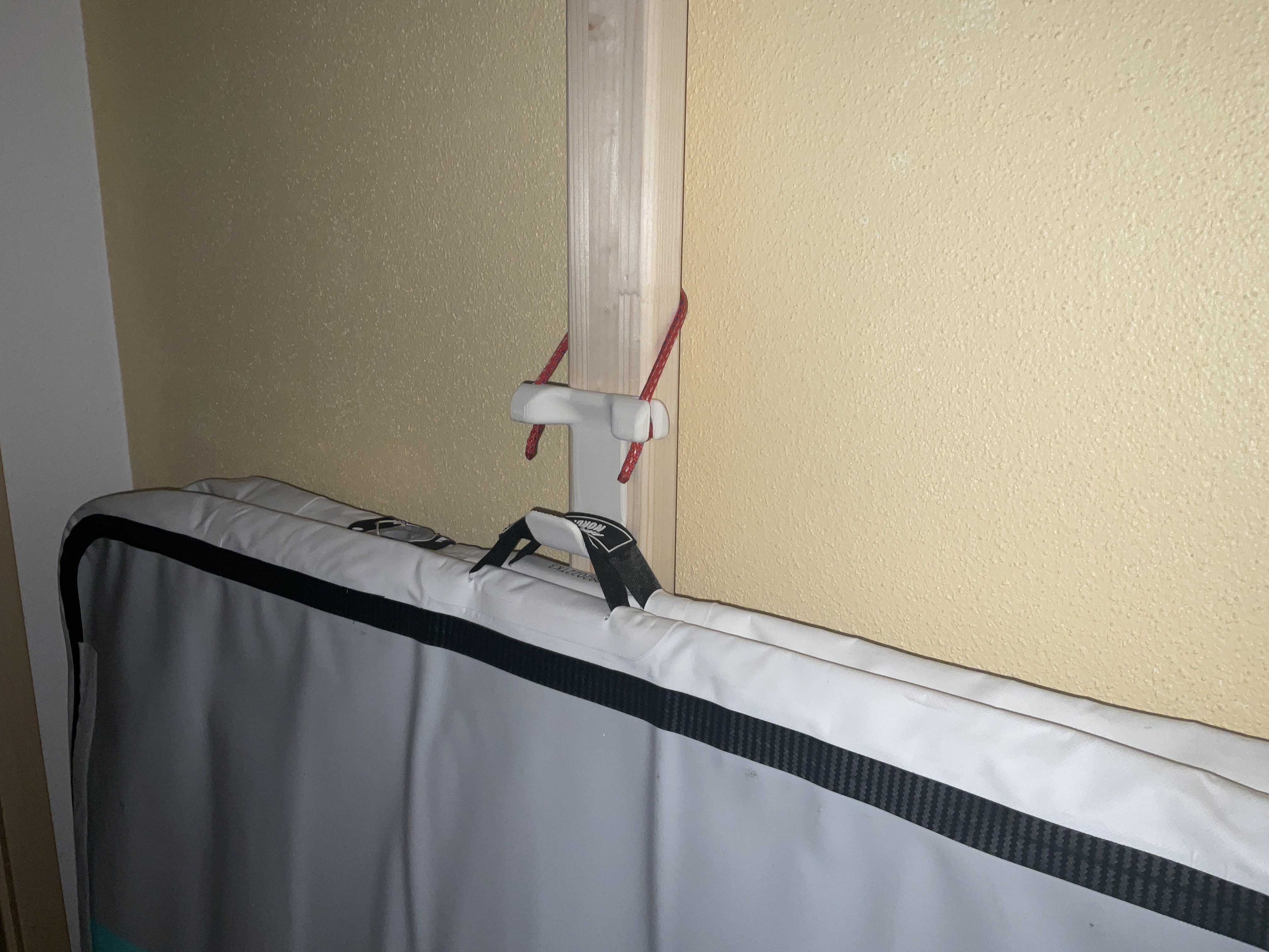 Adjustable hanging hook, e.g. for an AirTrack mat