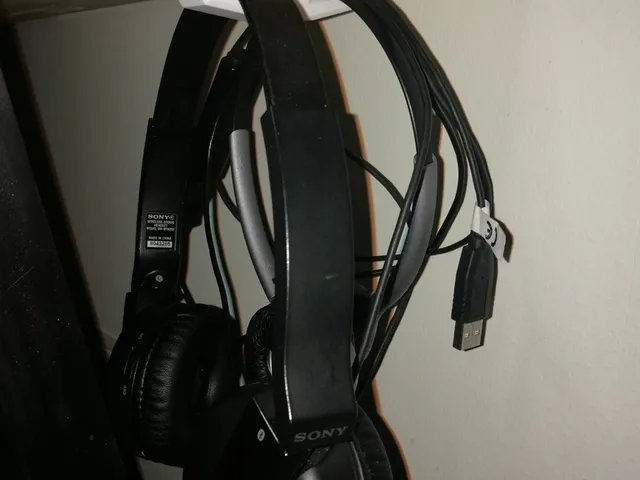 Under desk headset hanger.