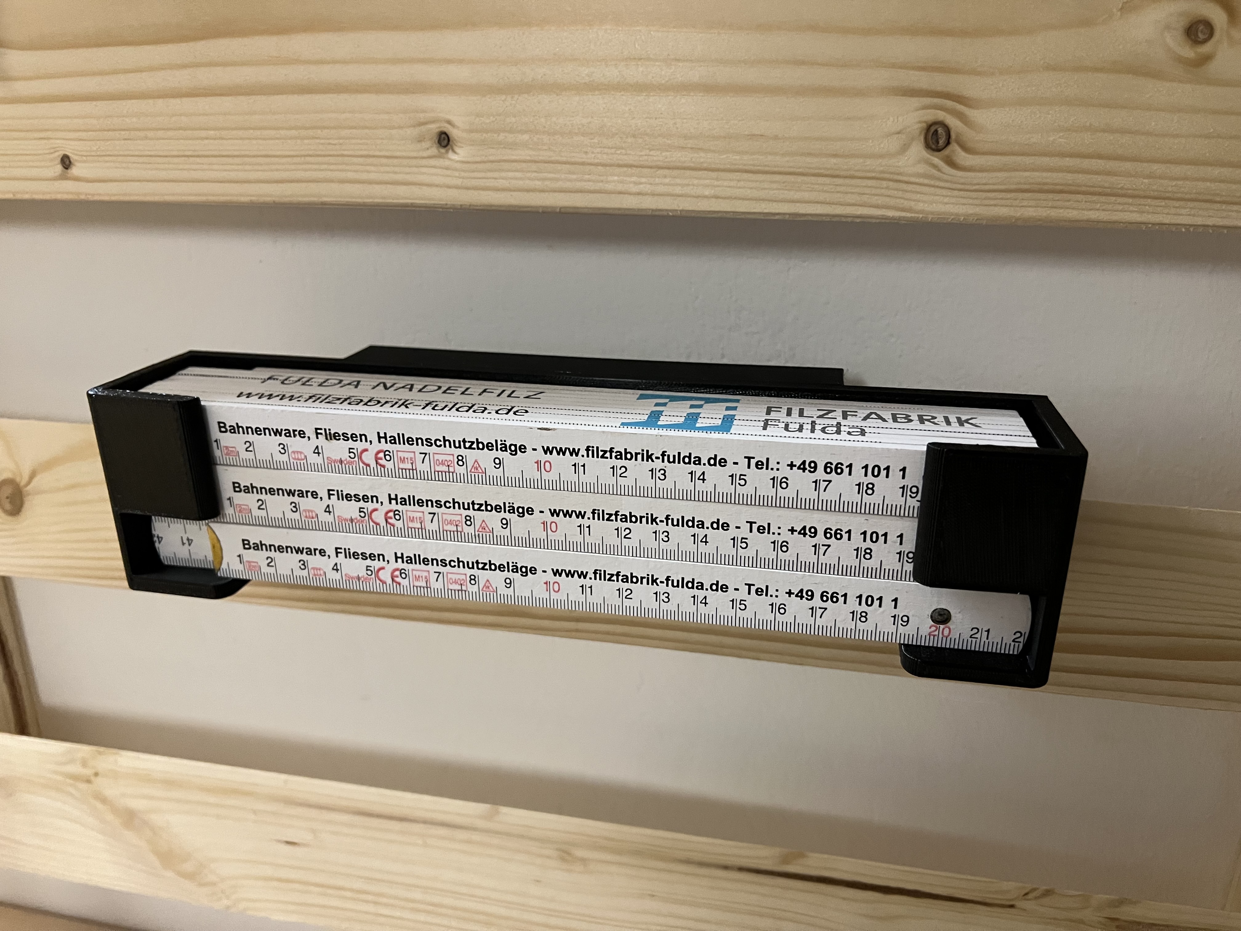 Folding rulers holder