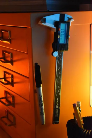 Magnetic holder for a digital caliper