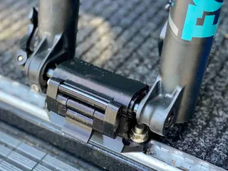 Thru axle fork mount outlet