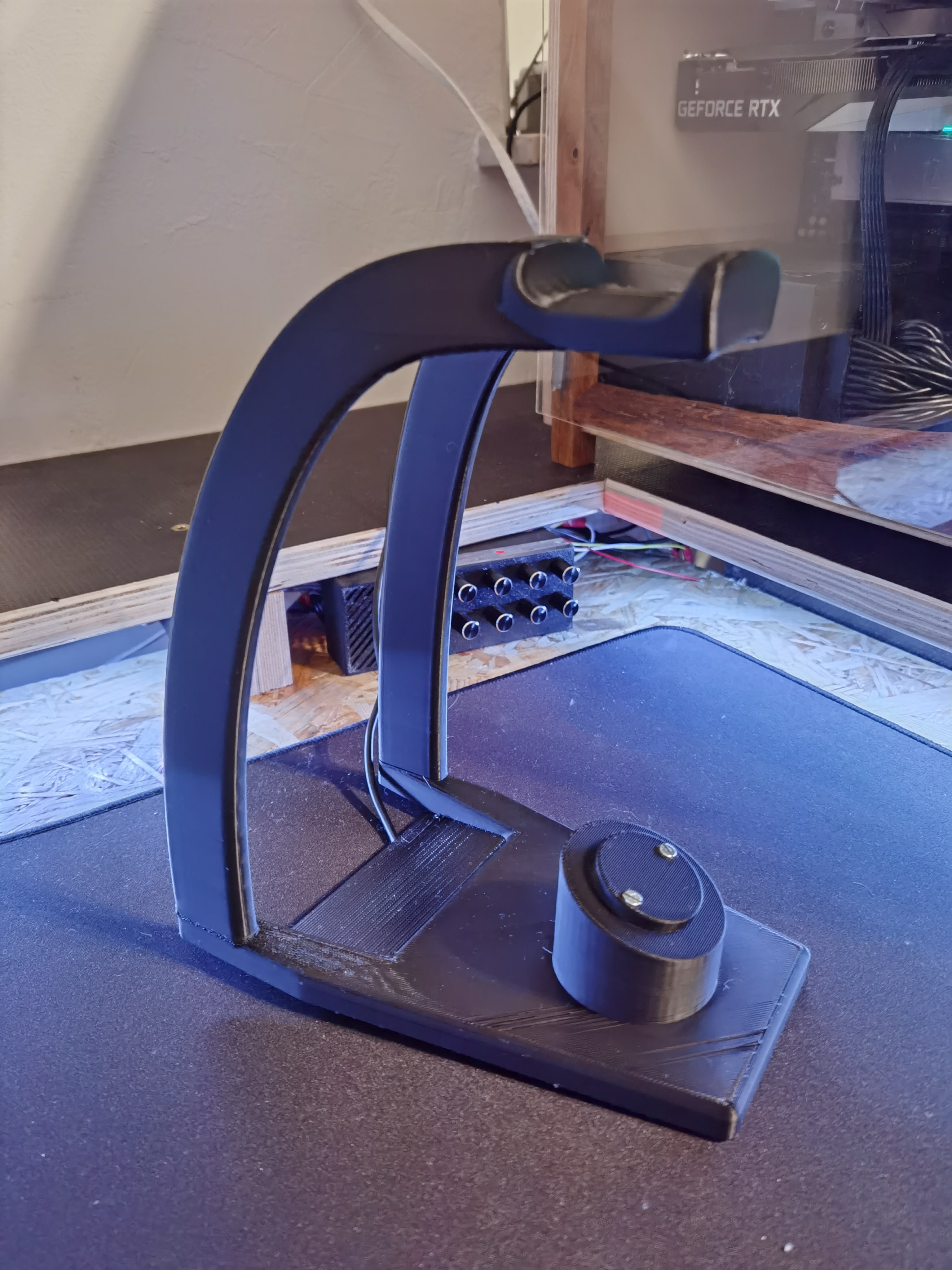 Headset stand with integrated charging station for Logitech mice