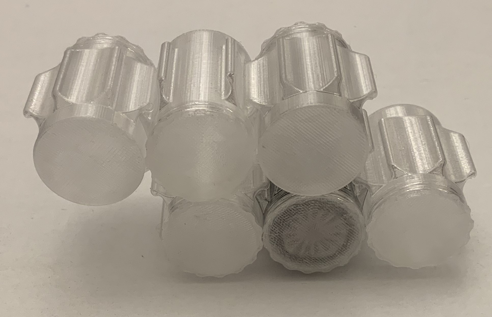 MiniZ tire container can with threaded cup stackable to a grid by