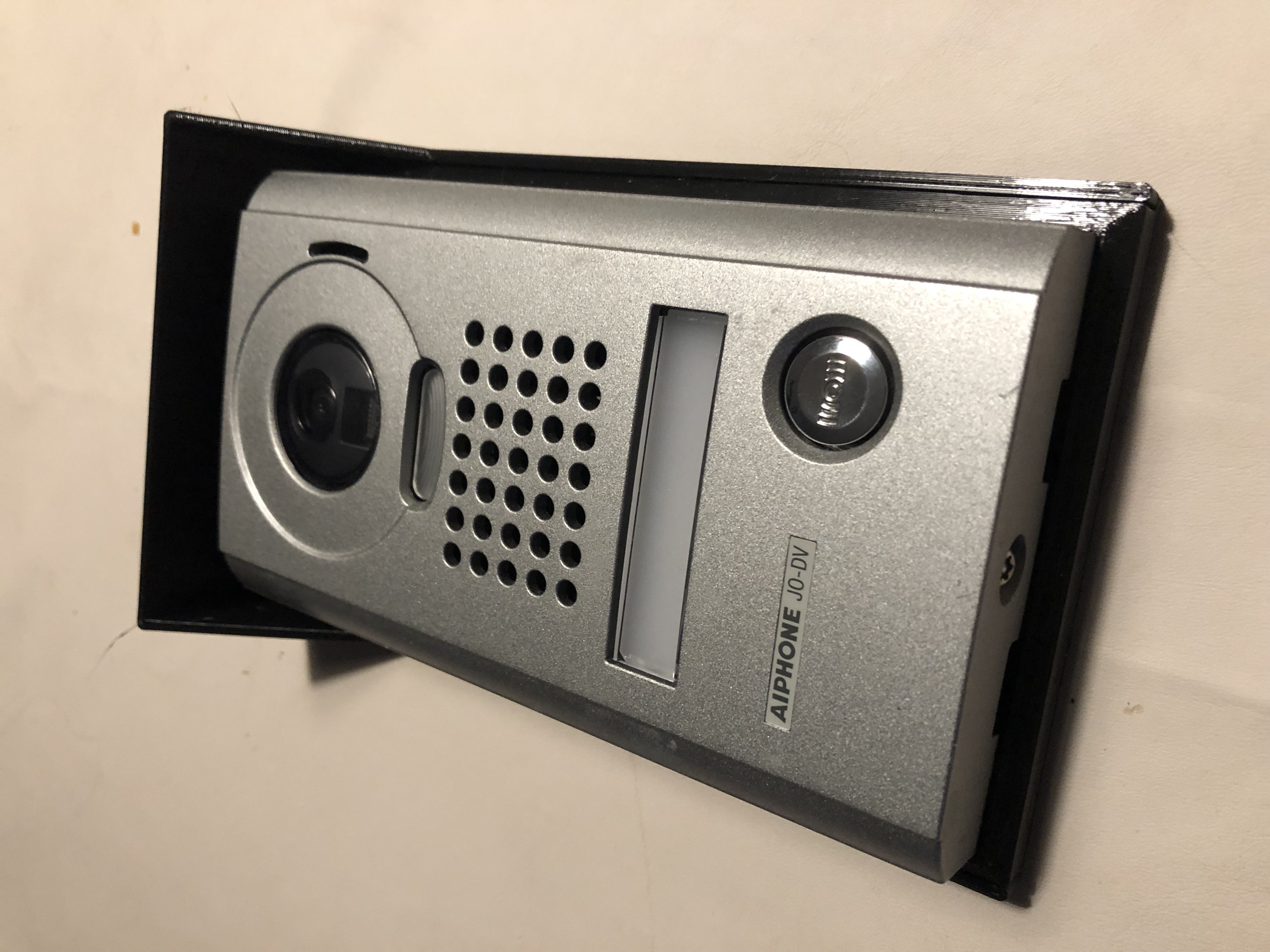 Inclined support and rain shield for Video Intercom System - AIPHONE
