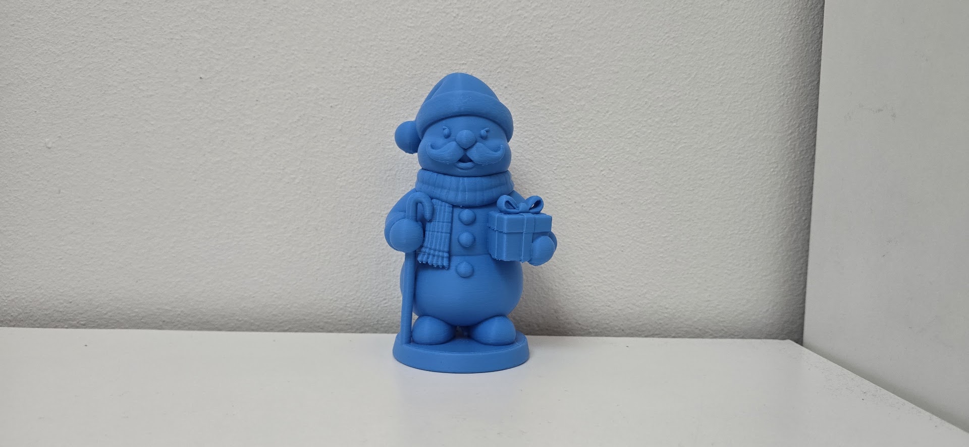 Gentleman Snowman with Moustache, Cane, and Gift Christmas Figurine