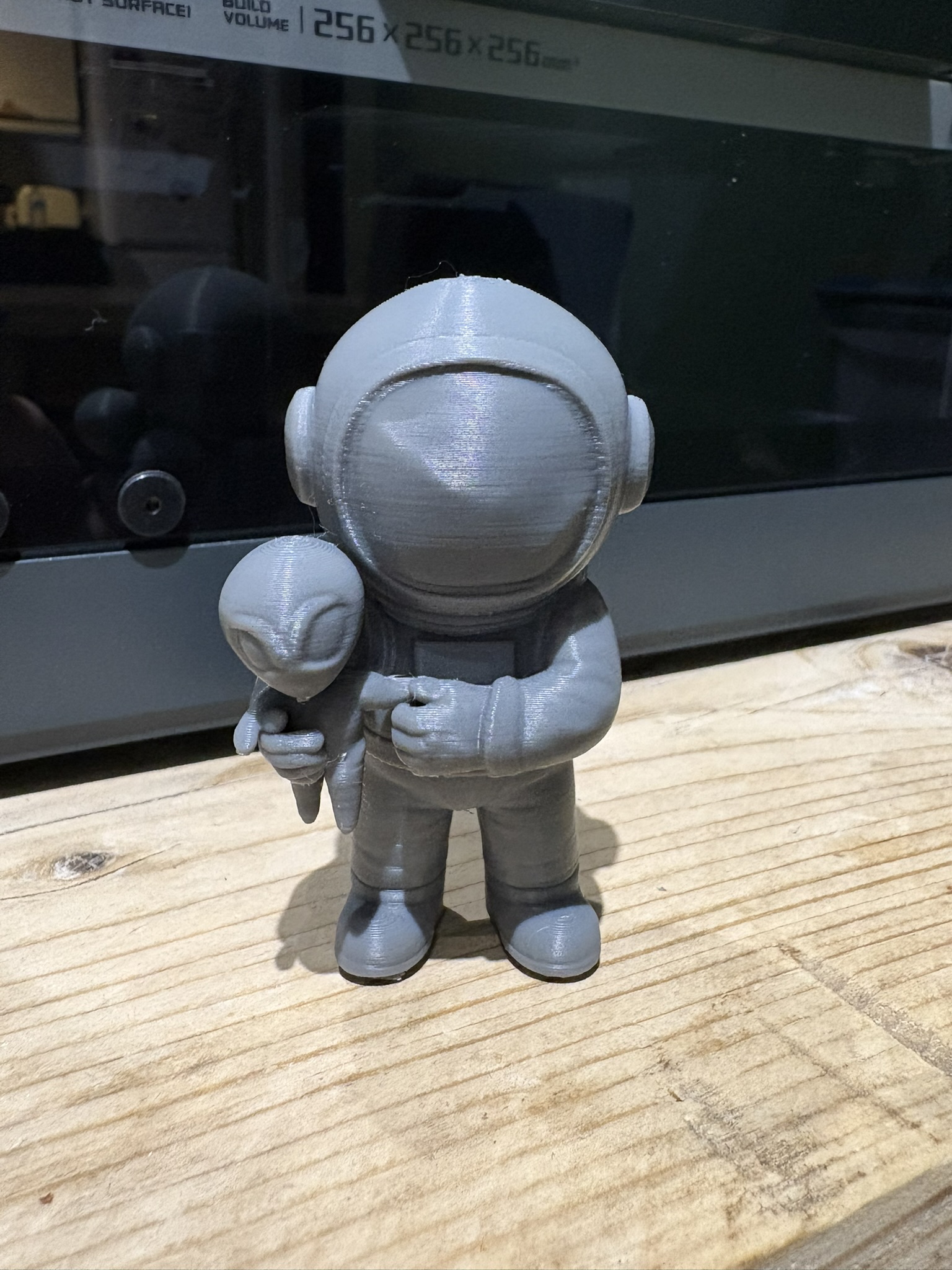 Astronaut Spaceman holding cute Alien plushie