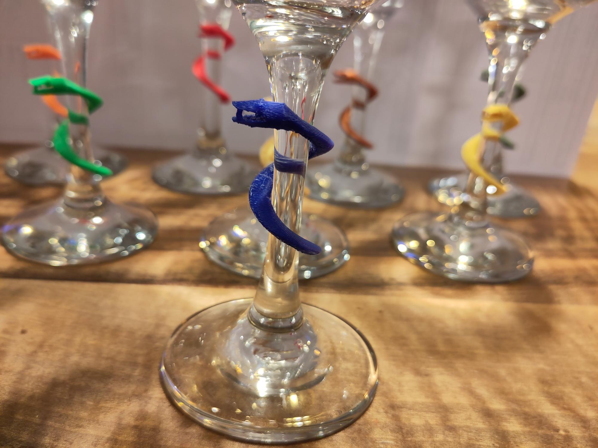 glass marker snake.  You’ll never lose your glass at a party again!
