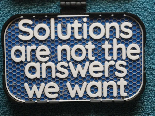 Solutions not wanted sign
