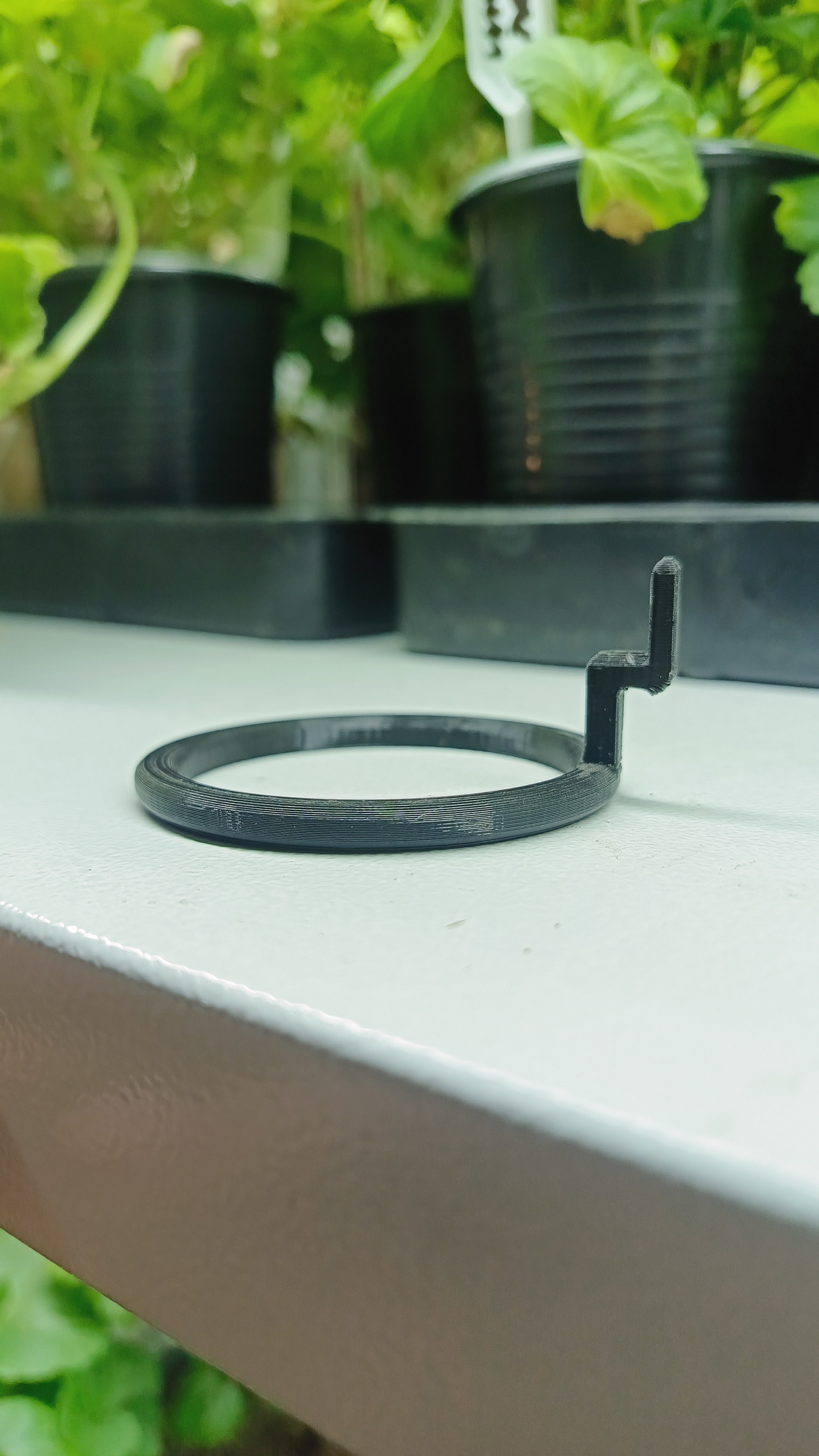 Mount for a seedling cup on a rack, internal diameter 50 mm, external 60 mm.