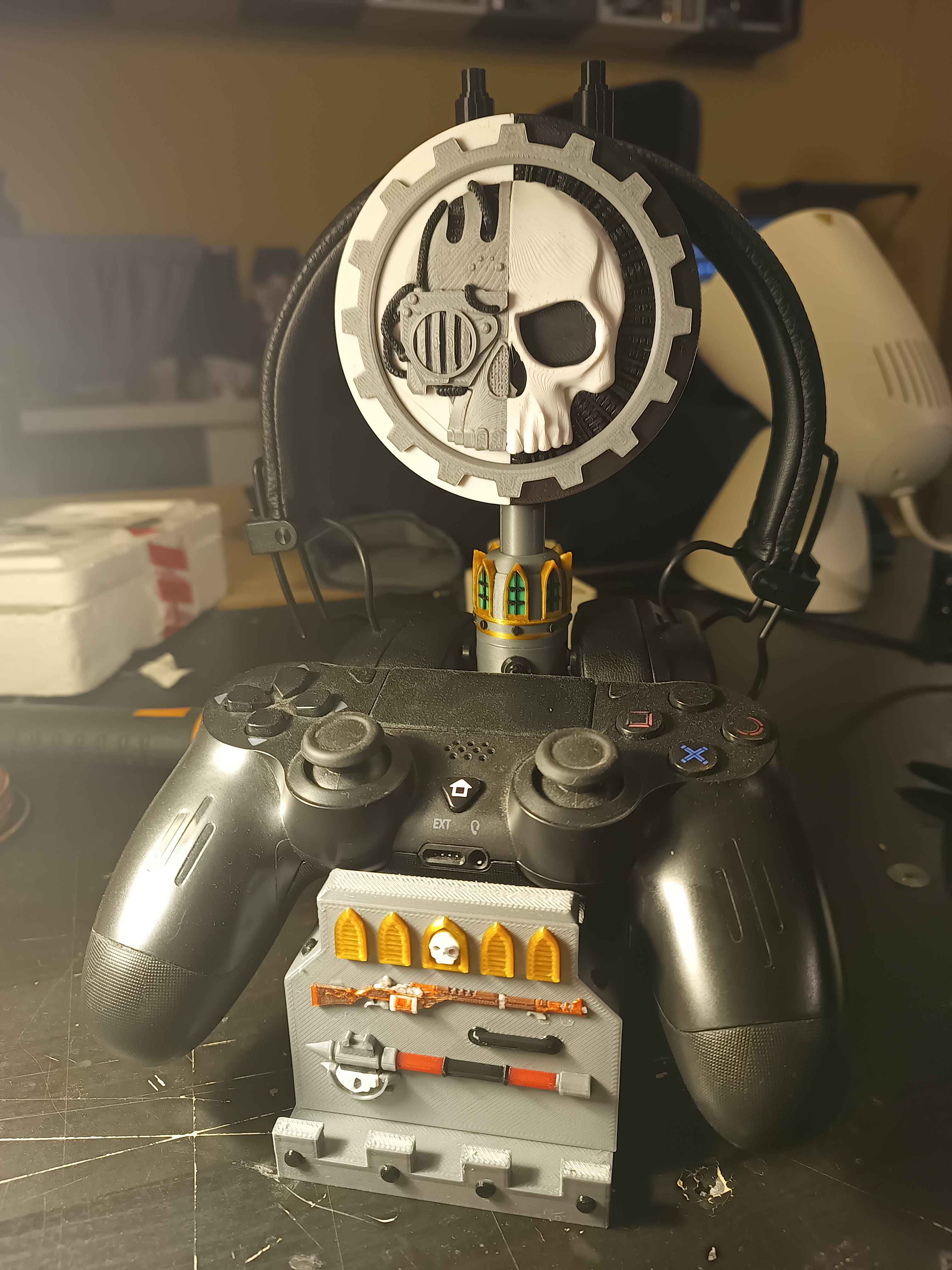 Grimadarkfuture: Tech support priest themed Earphone and controller holder