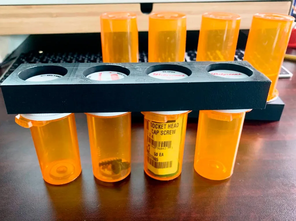 A Pill bottle stand for four Walgreens bottles - one large, two medium and  one small by NotLikeALeafOnTheWind, Download free STL model