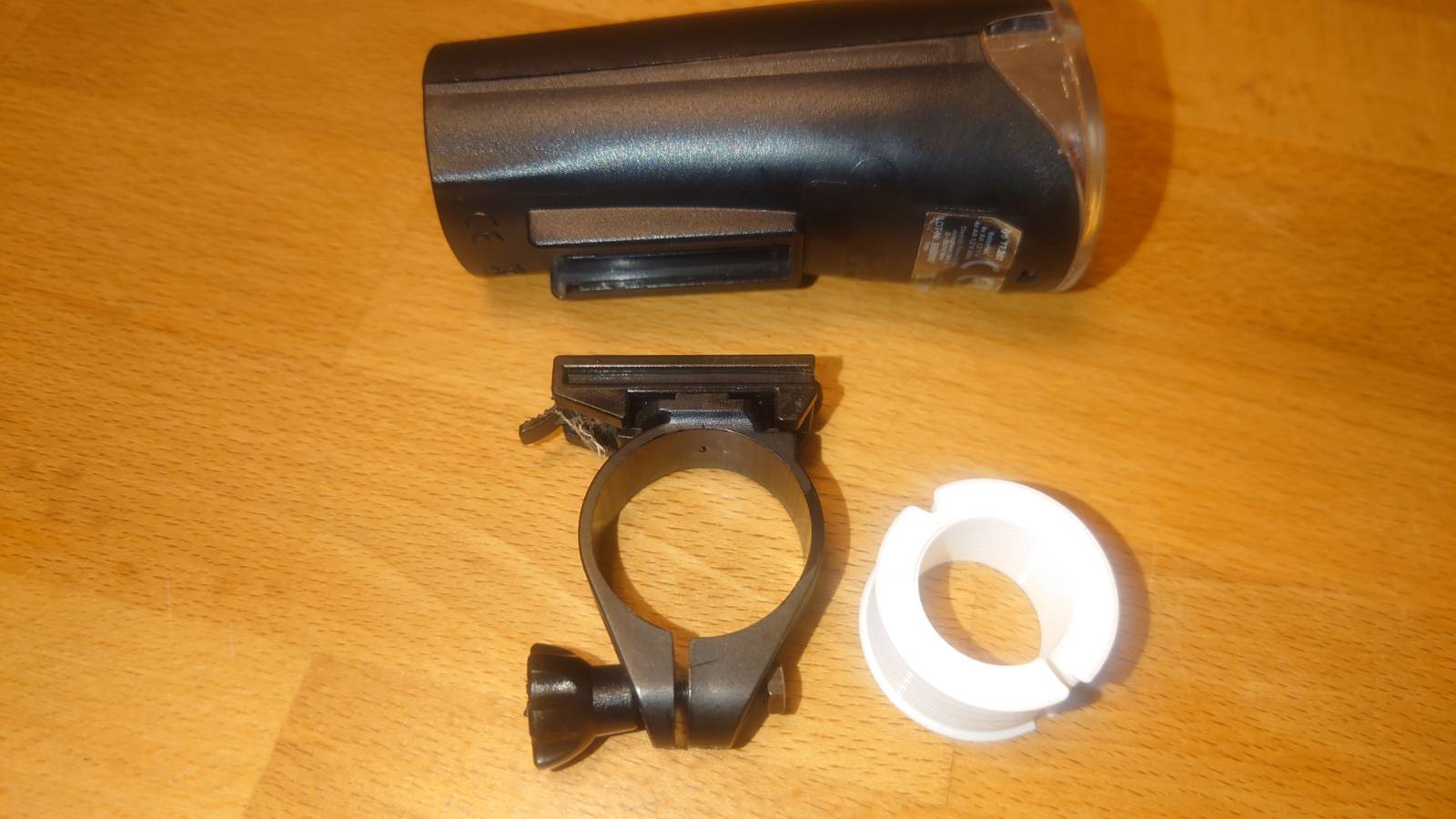 Bike handlebar spacer / adapter for standard camera and flashlight mounts