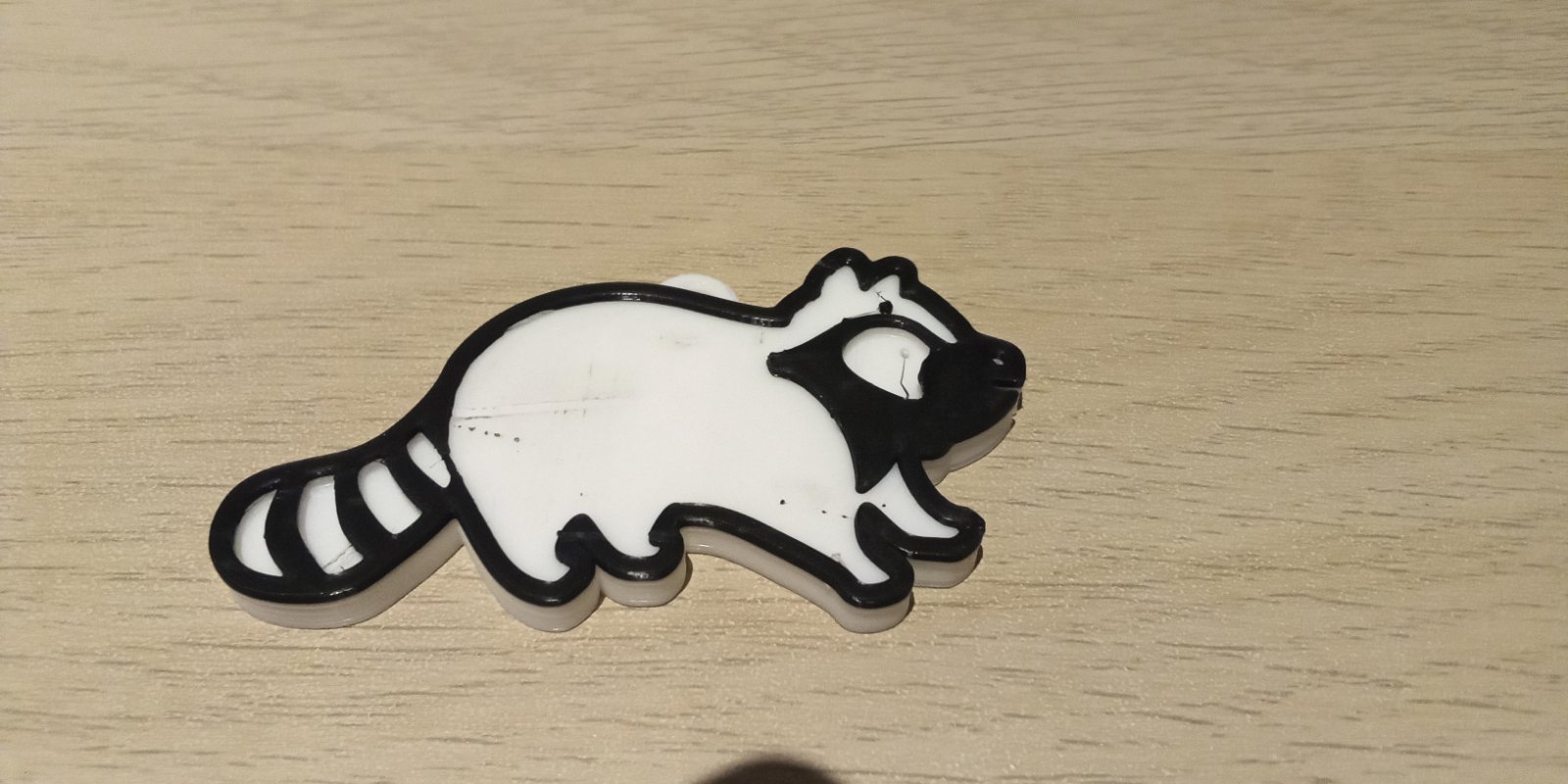 Cute multicolor raccoon with keychain