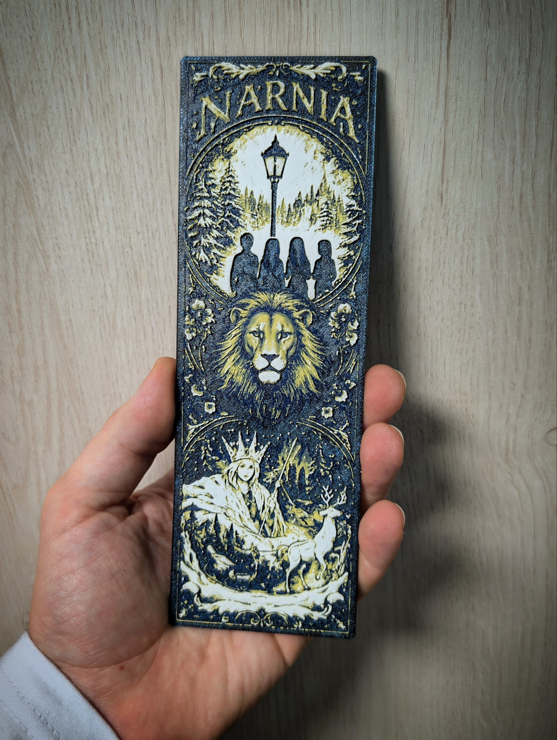 A bookmark based on The Chronicles of Narnia: The Witch and the Wardrobe, made using the Hueforge technique.
