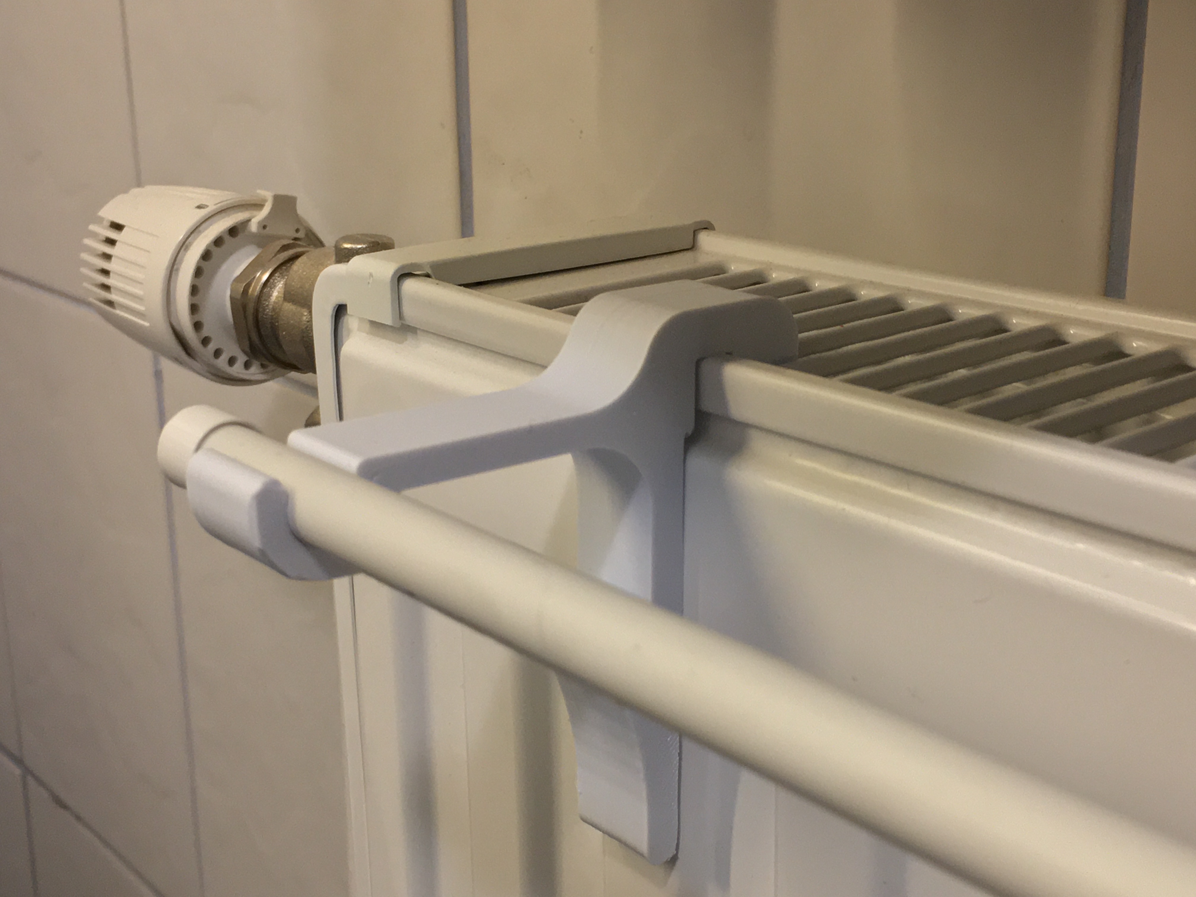 Radiator towel rail online hook