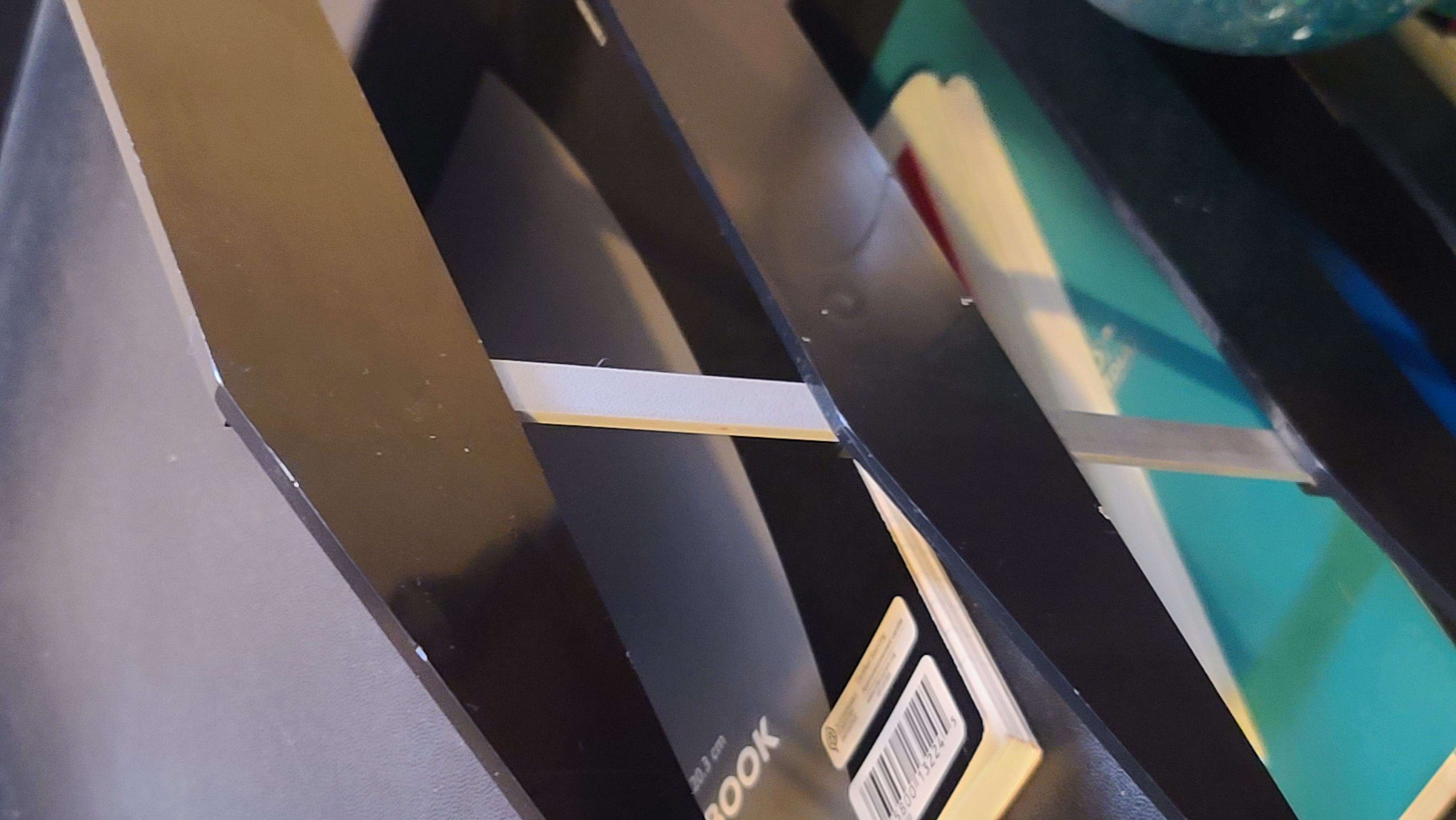 Paper tray support leg.