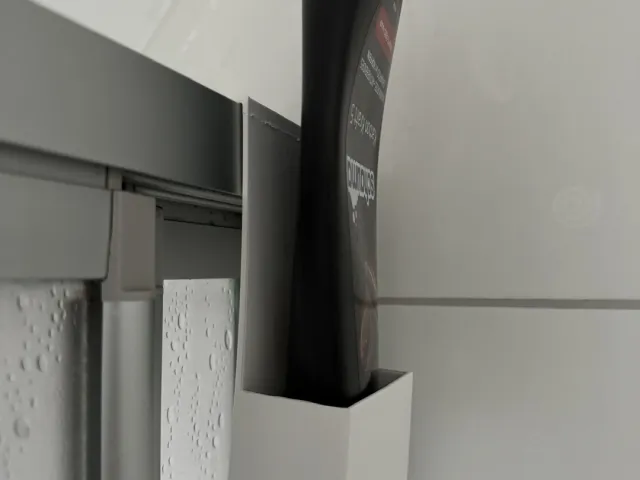 Shampoo bottle holder