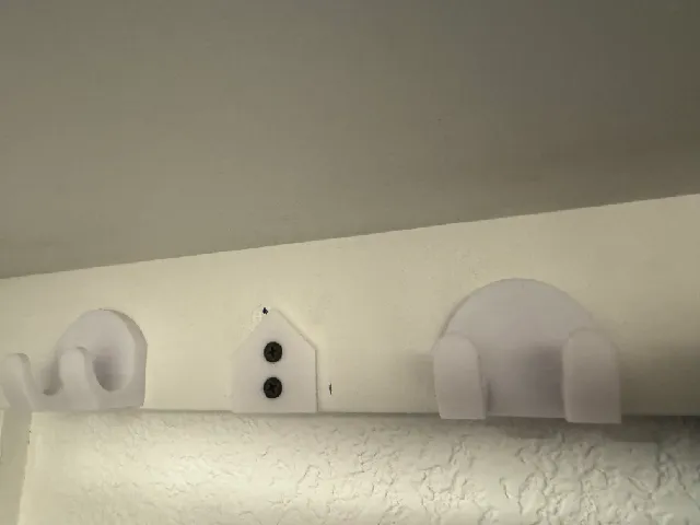 Clothes hook with hidden fasteners