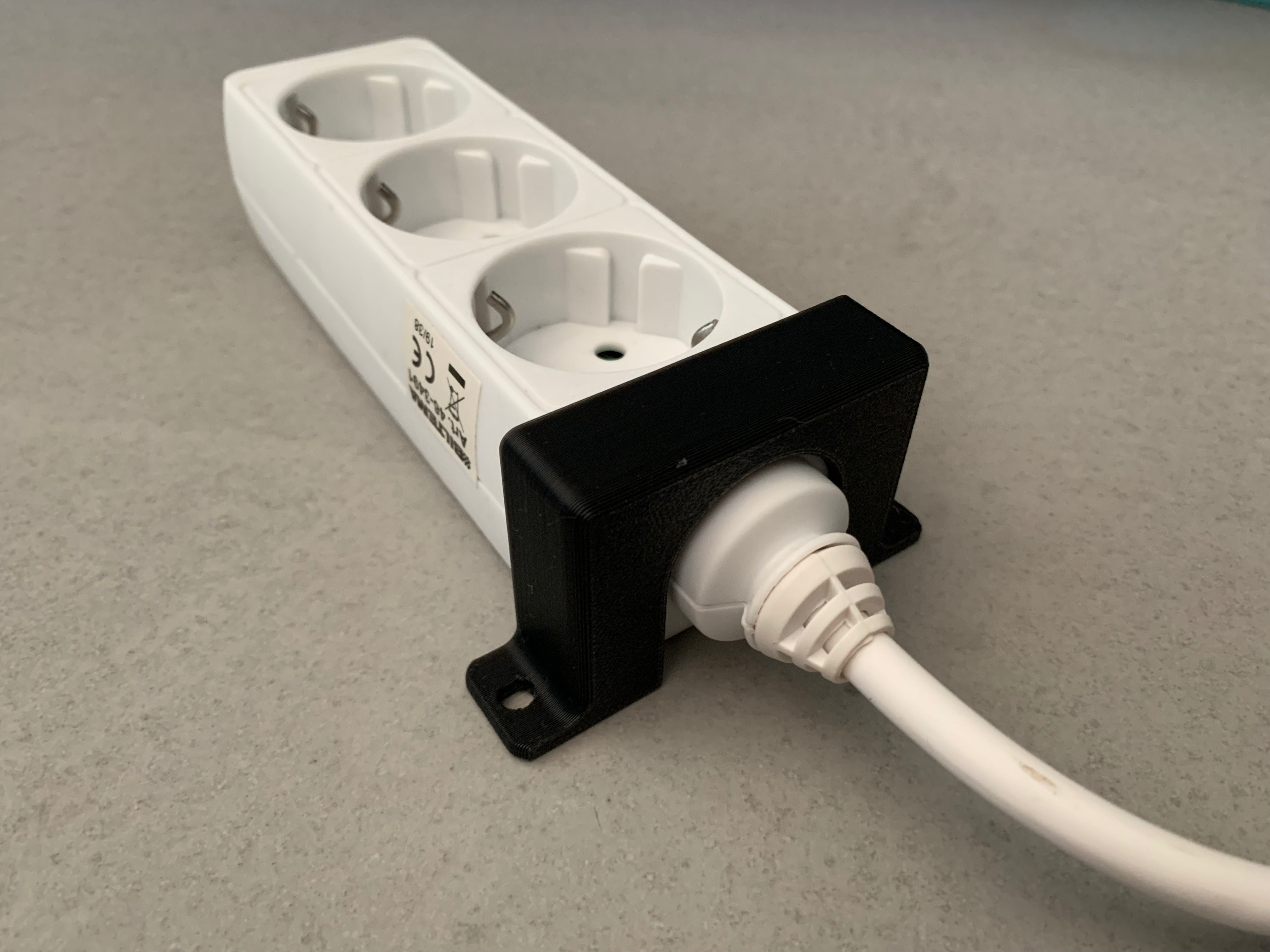 Power strip mount for wider power cords