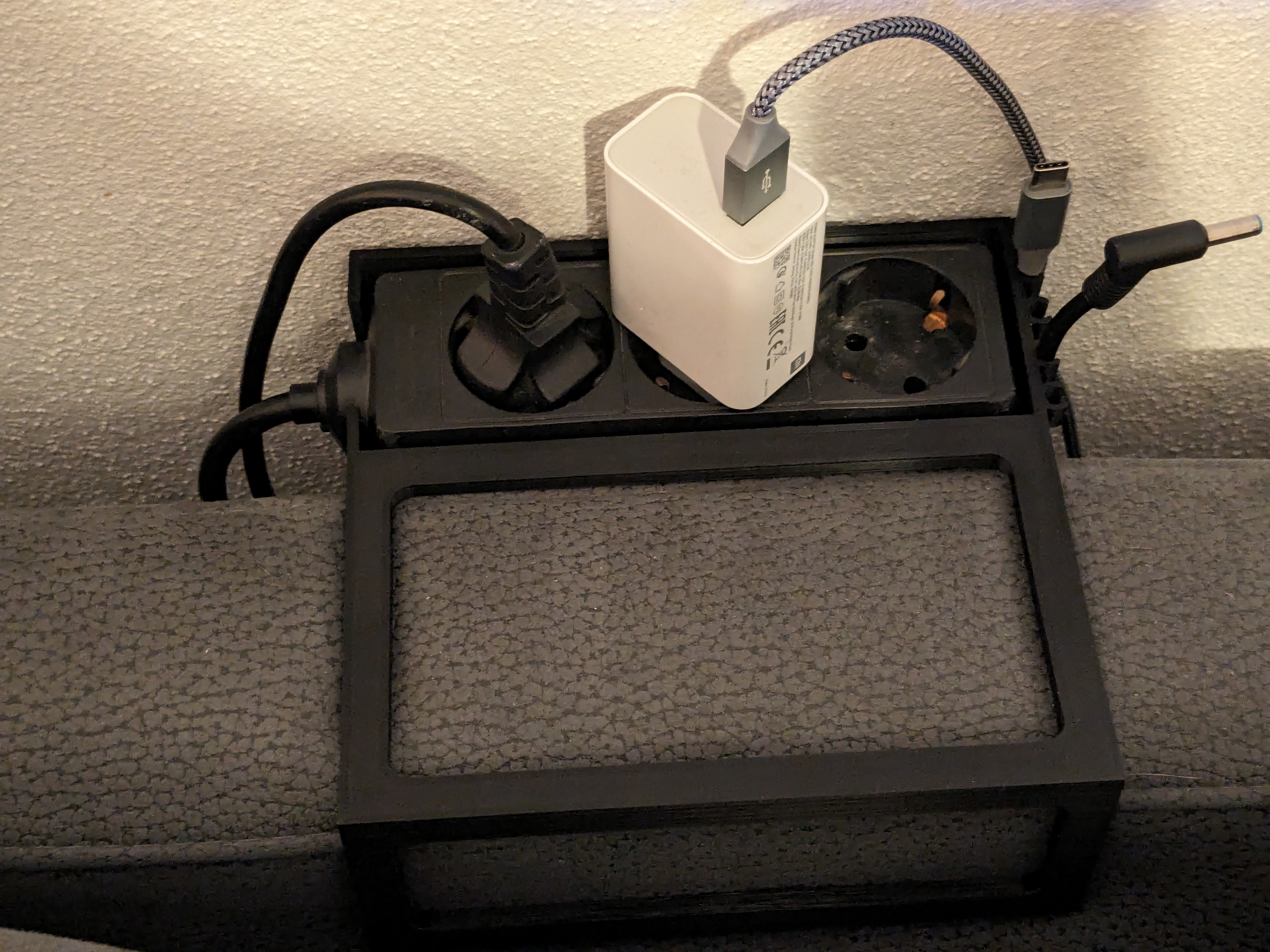 Couch power strip holder