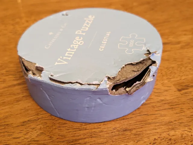 Jigsaw Puzzle box lid - or - Getting poochie out of hot water