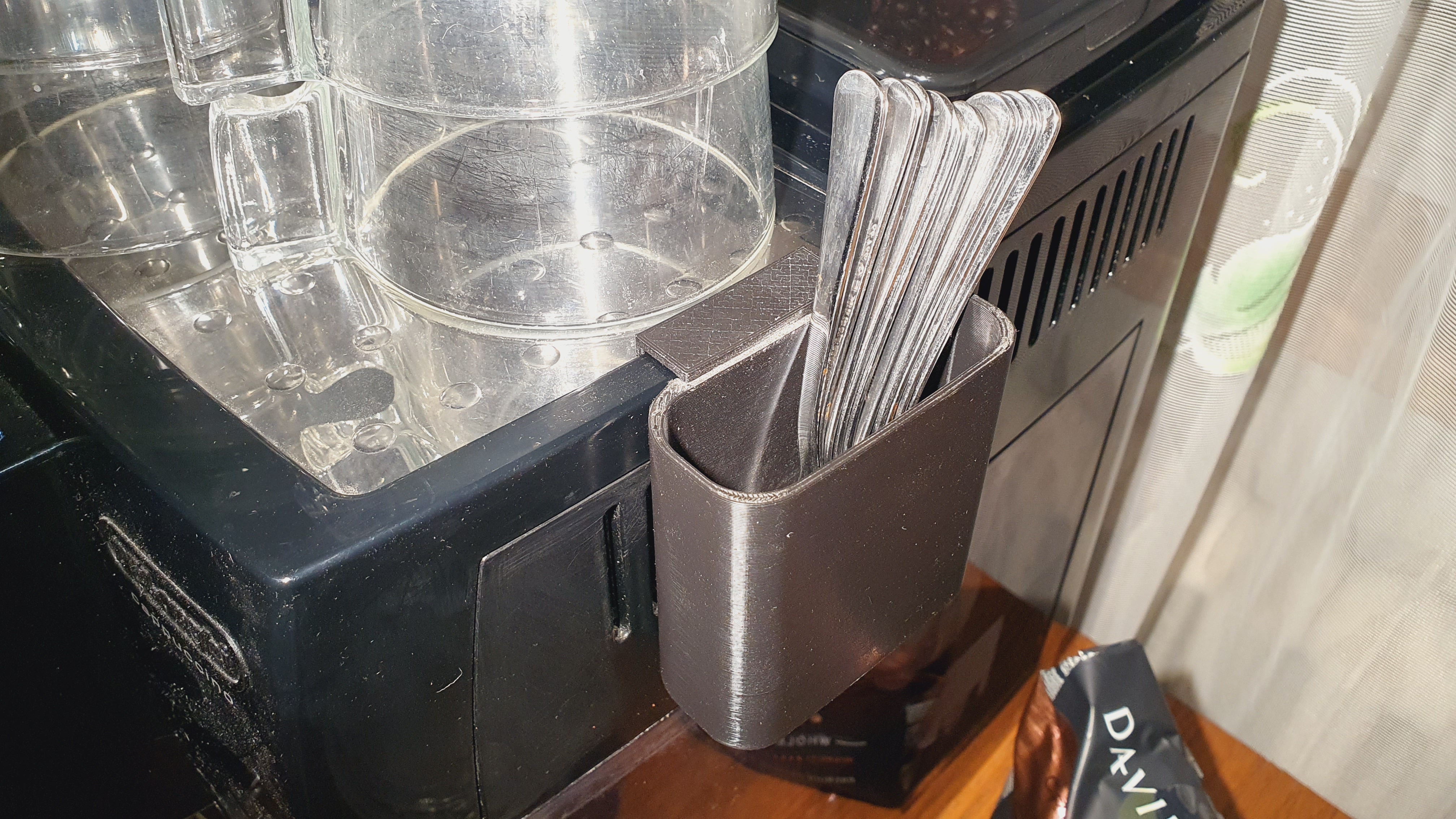 Coffeemaker spoon holder