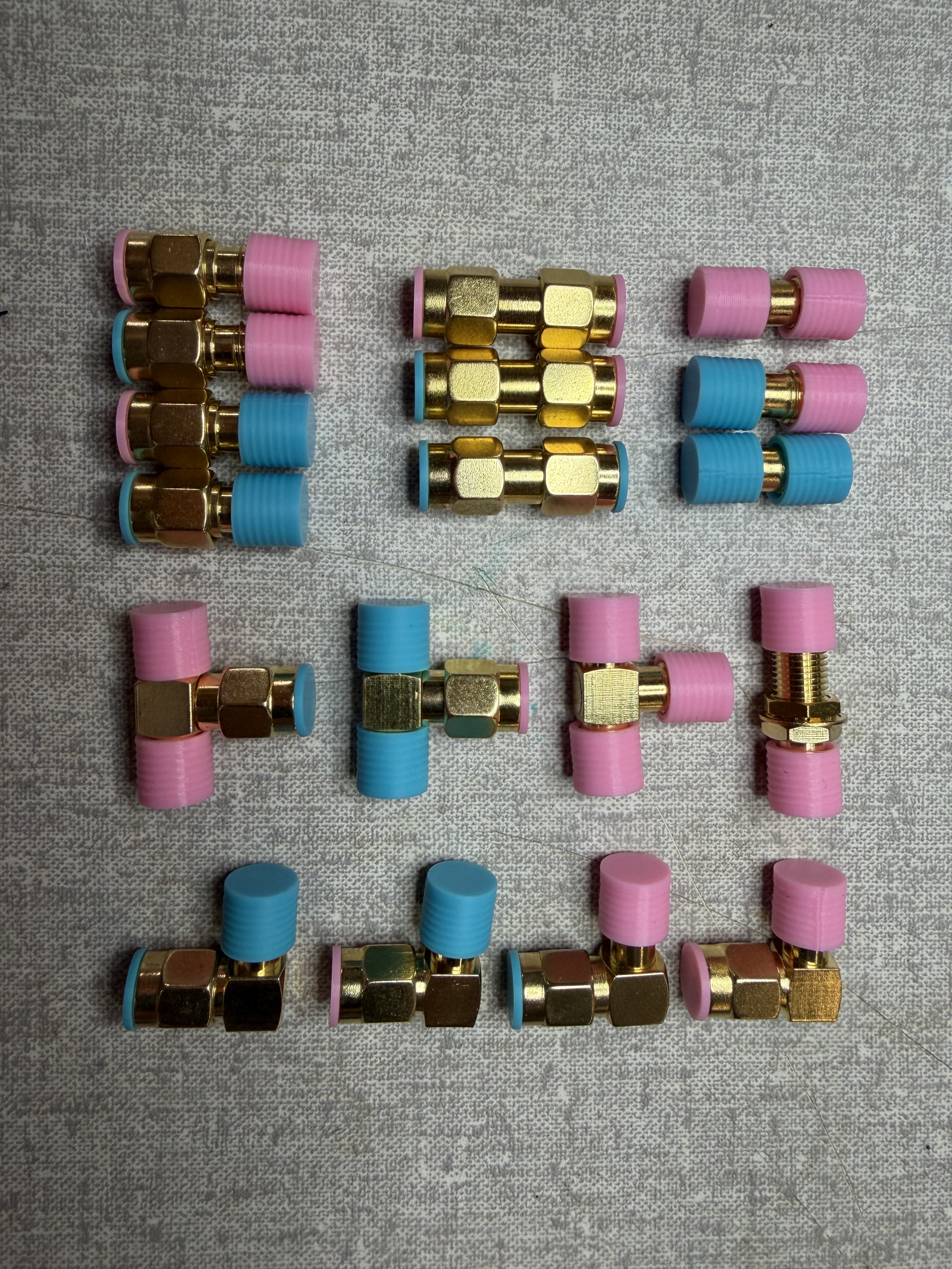 Gender-coded Pink and Blue caps and plugs for SMA Adapters