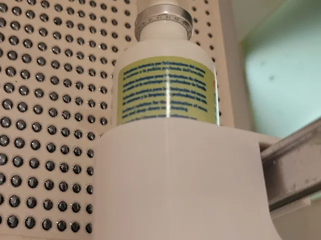 Bottle holder for the shower cabin glass
