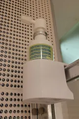 Bottle holder for the shower cabin glass