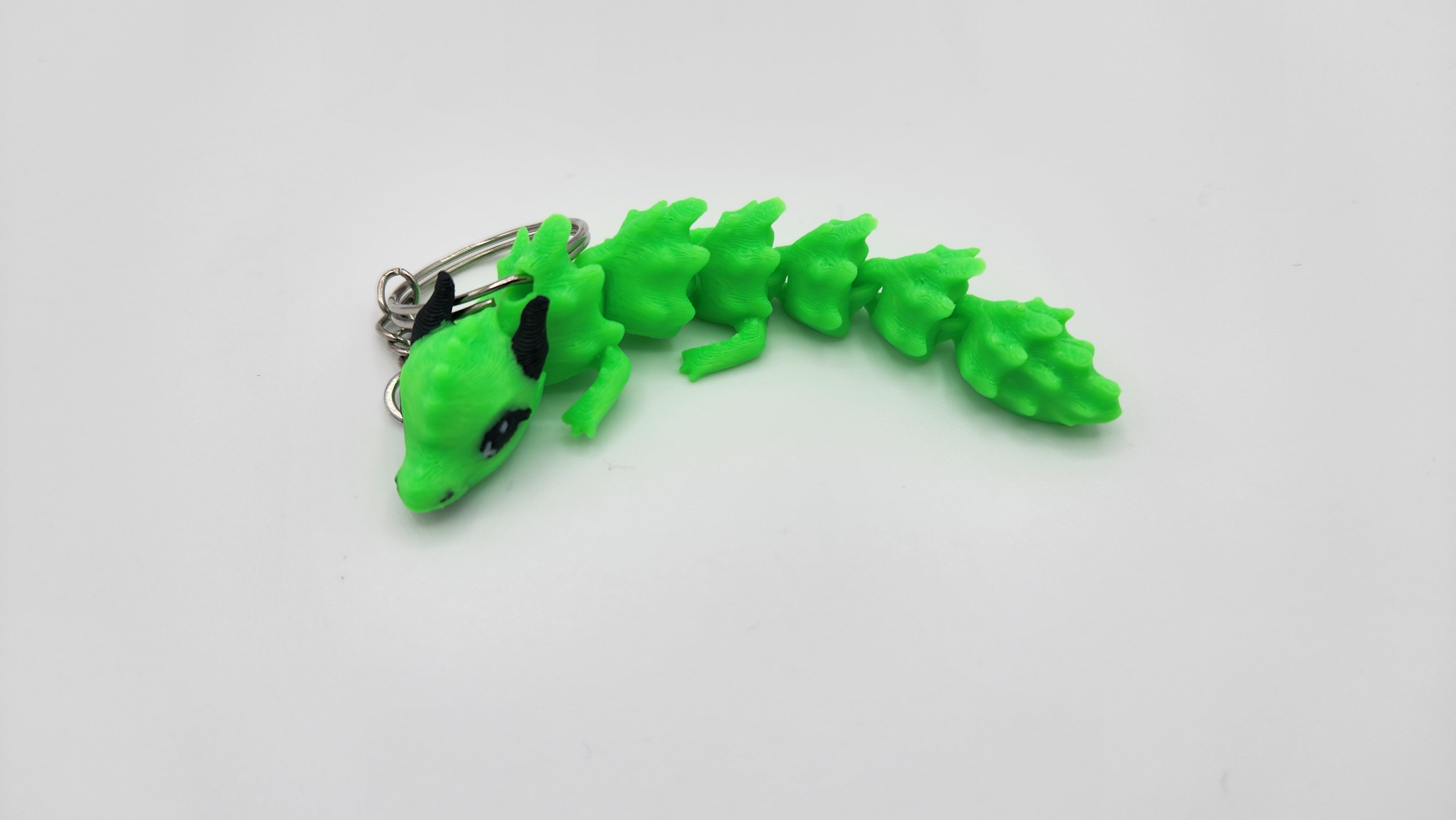Miniatura 4 do modelo 3D FLEXI CUTE DRAGON KEYCHAIN