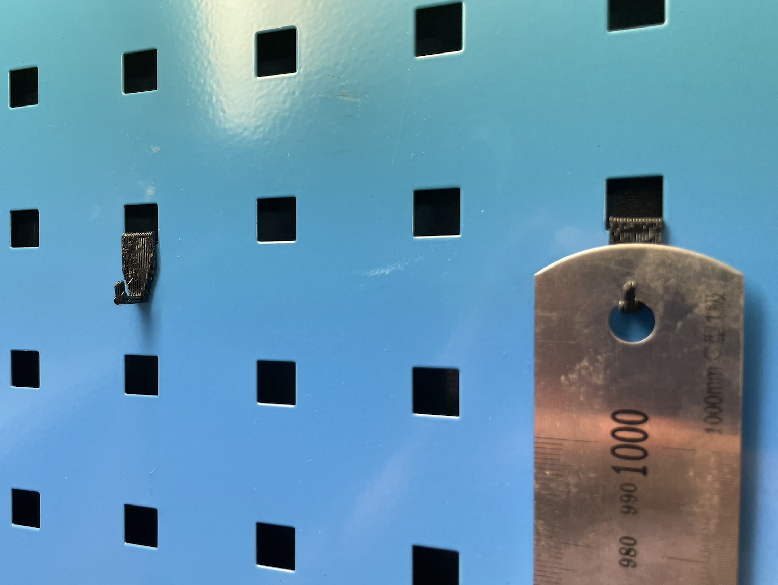 Hook for workshop cabinet - perforated panel