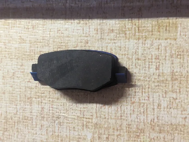 A holder for a 2022 Peugeot 208 brake pad from a car your friend crashed