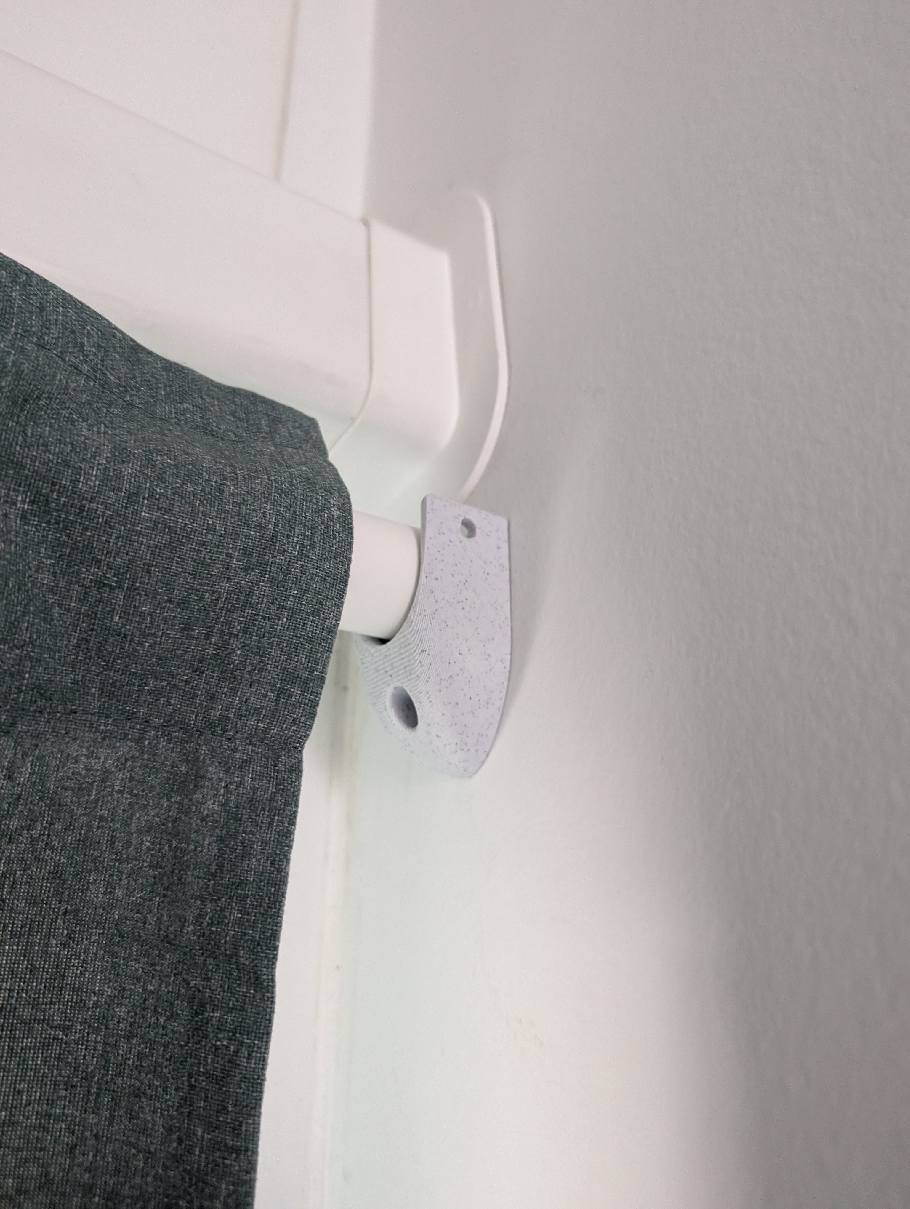Wall support for curtain rods