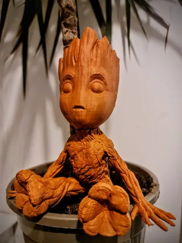 Baby Groot (sitting and waving)