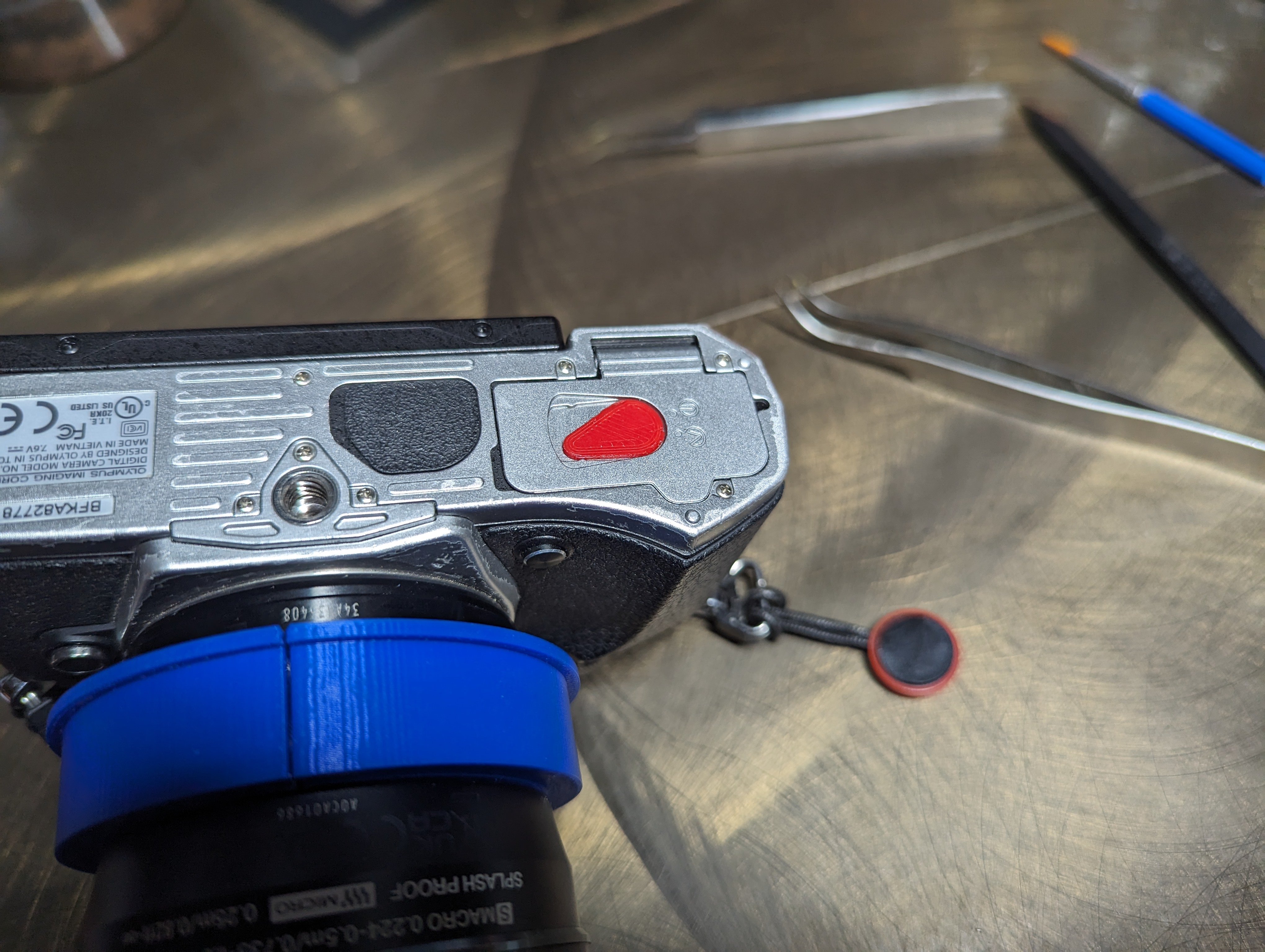 Battery door lever for Olympus em5 mkii