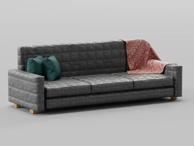 Sofa with two pillows and a blanket