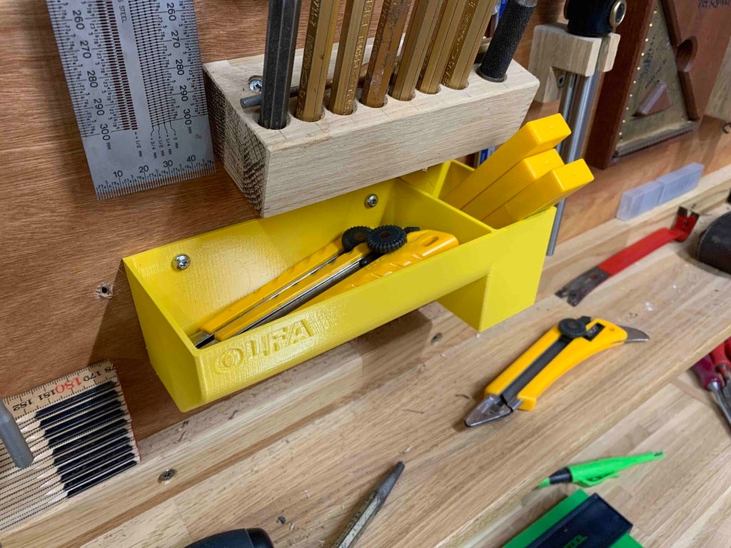 Holder for OLFA utility knives with room for spare blades by Kerndrup