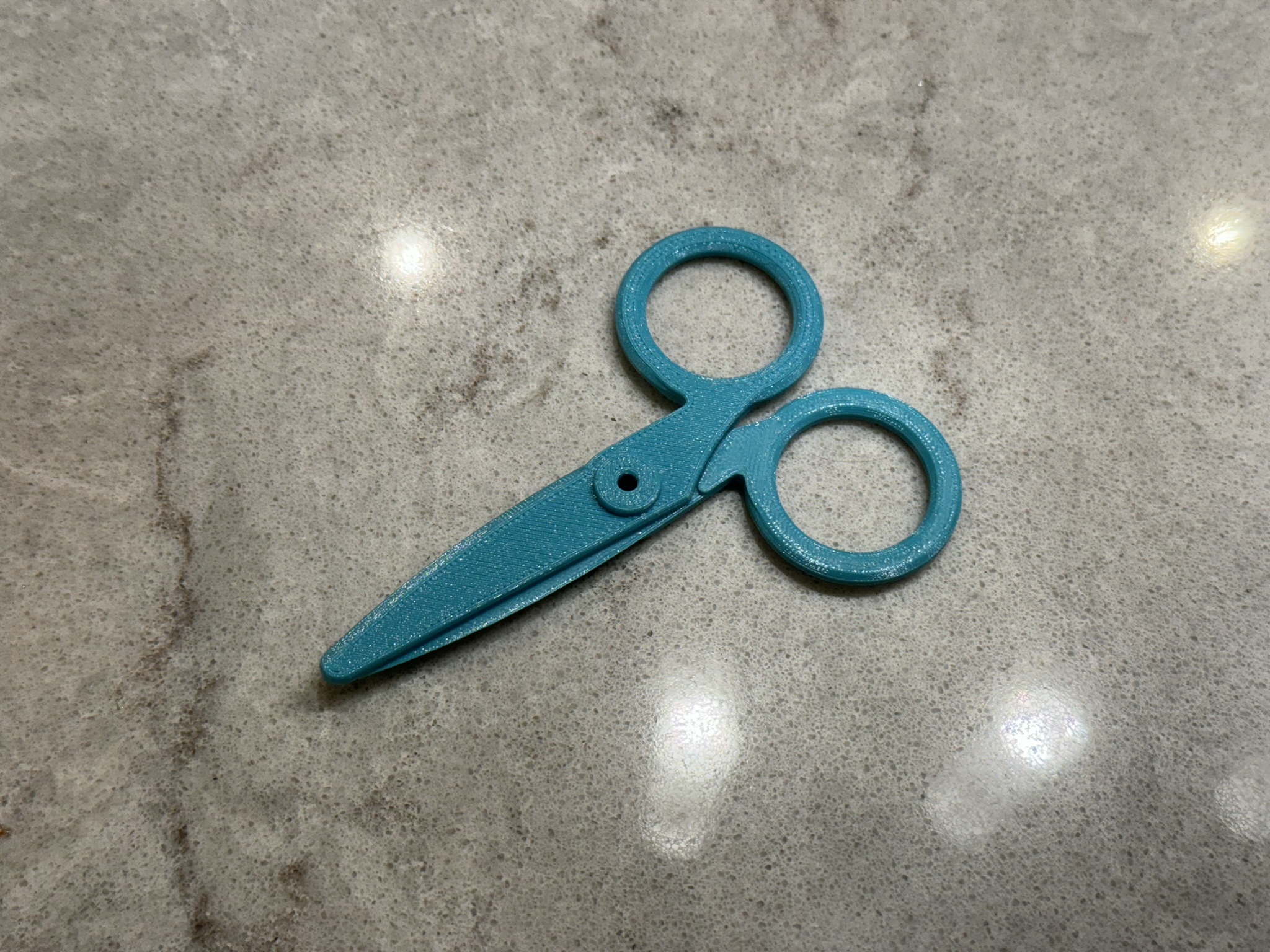 Paper scissors blade with larger finger holes
