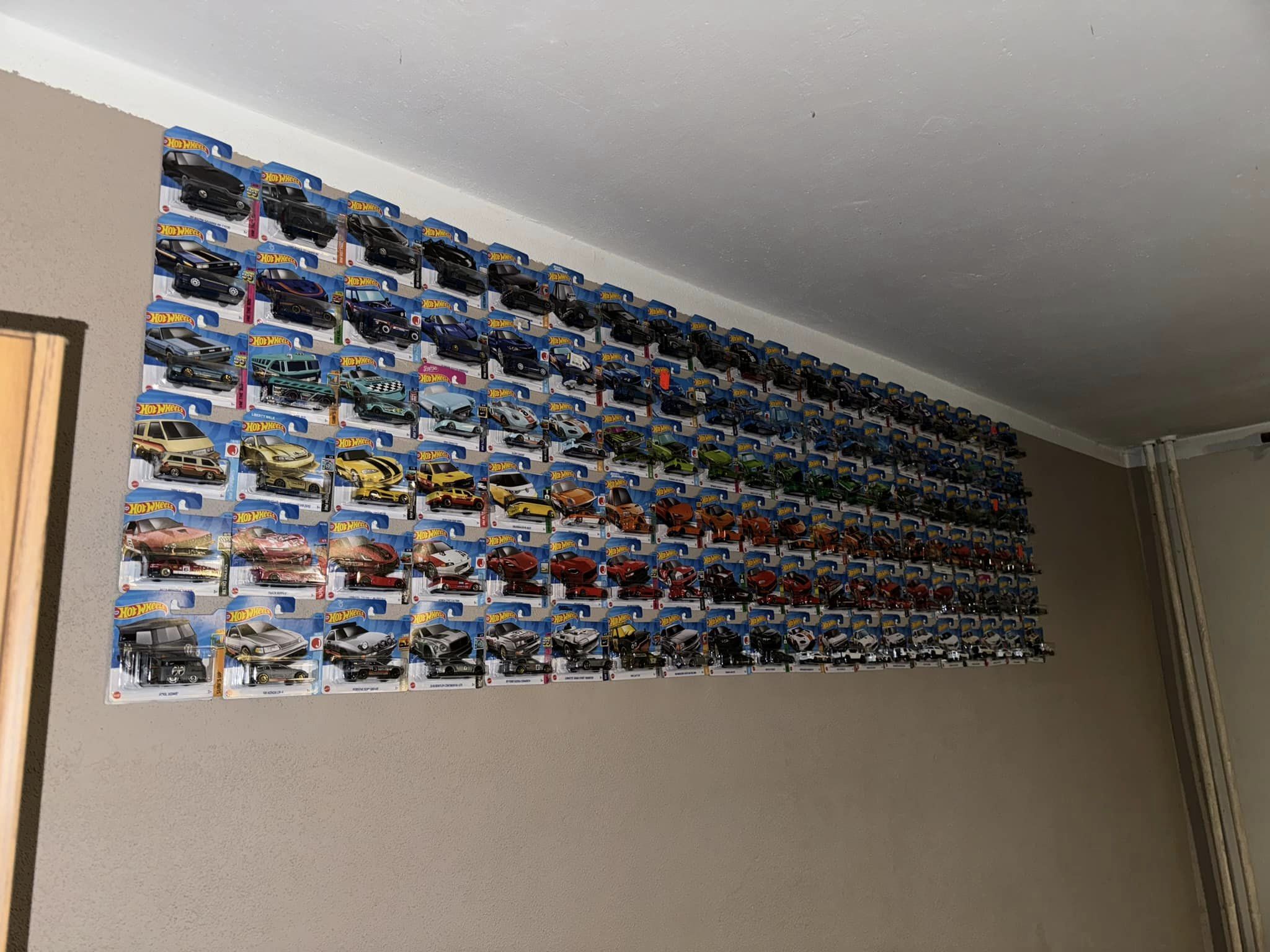 Hanging hot wheels on wall online