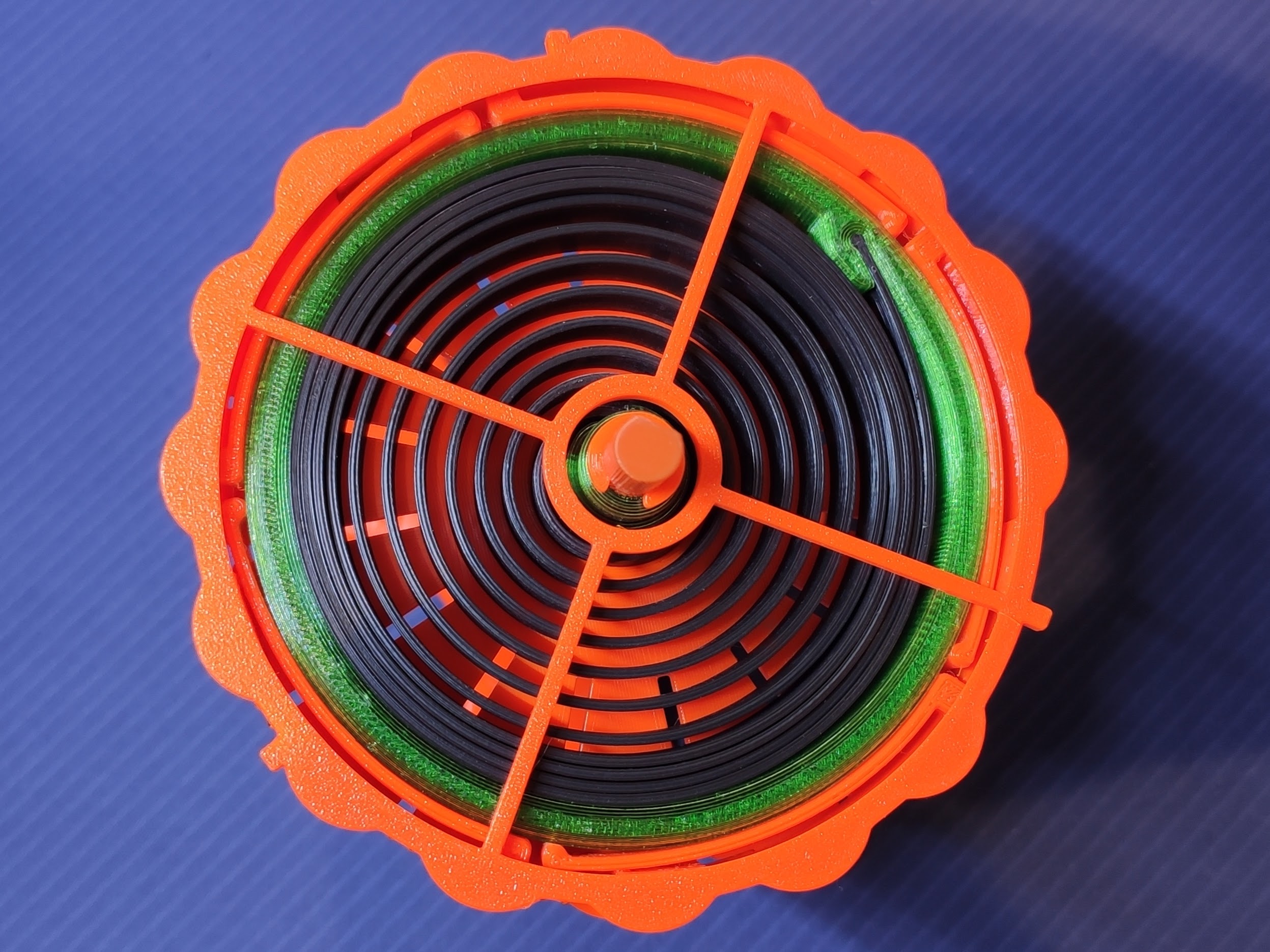 Reusable spring for Universal Auto-Rewind Spool Holder