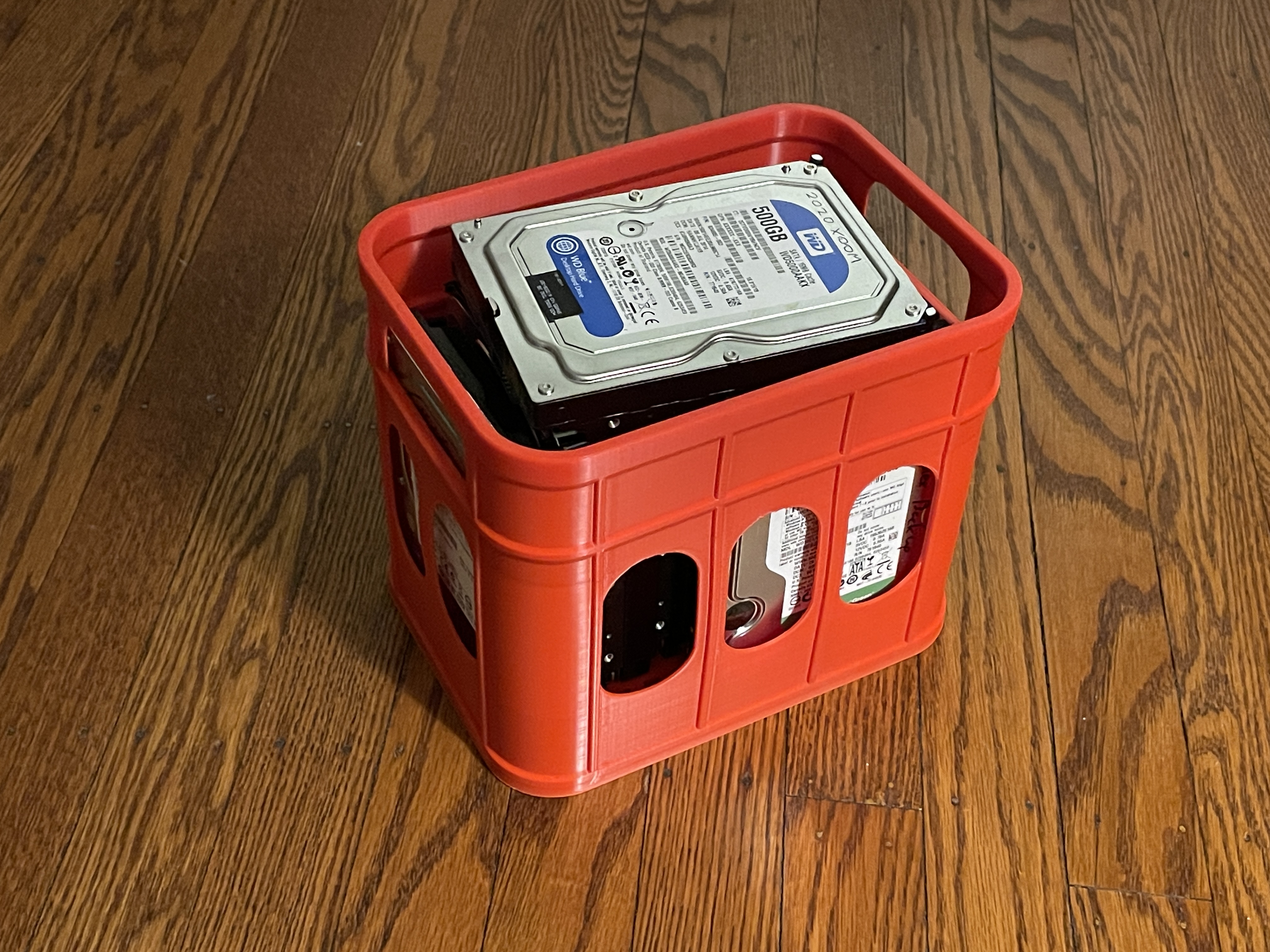 A small plastic crate for holding hard drives or bottles (please scale according to your need)