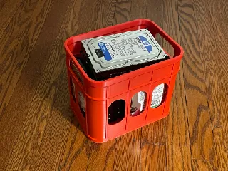 A small plastic crate for holding hard drives or bottles (please scale according to your need)