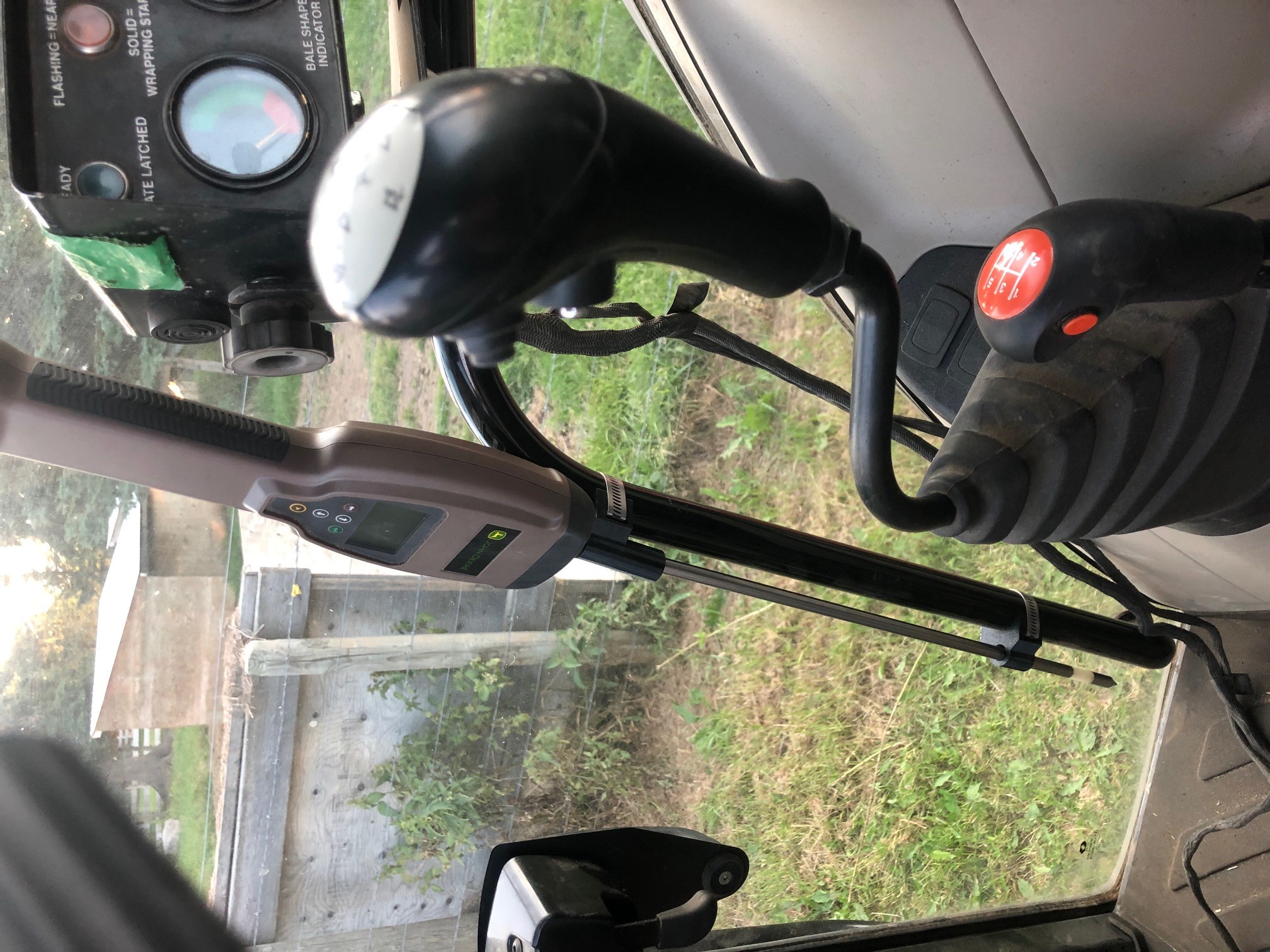 Door mount holder for hay moisture tester
