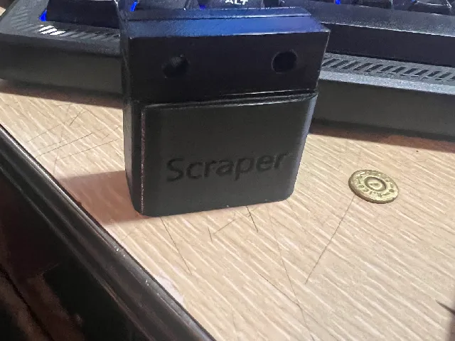 scraper wall mount with screw holes and lettering