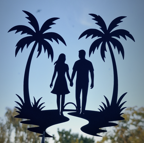 A couple walking between palms silhouette