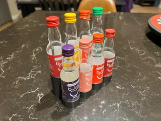 Minimalist SodaStream flavor bottle holder
